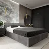 A modern bedroom with a large upholstered bed as the main focus. Produktbild-Vorschau