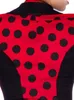 Close-up of the back of a red and black polka dot jacket. Produktbild-Vorschau
