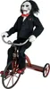 A doll of Billy the Puppet from the Saw movies riding a tricycle. Produktbild-Vorschau