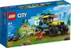 The image shows the packaging of a LEGO City 4x4 Off-Road Ambulance Rescue set, with a depiction of the assembled toy and minifigures in a natural outdoor setting. Produktbild-Vorschau