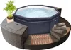 An inflatable hot tub surrounded by modular seating and a small plant. Produktbild-Vorschau