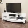 A white TV stand with a television on top, and decorative items. Anteprima dell’immagine prodotto