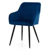 A blue velvet armchair with diamond quilting and black legs, presented on a white background. Produktbild-Vorschau