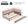 A diagram showing the dimensions and features of a pink upholstered bed with a pull-out trundle. Náhľad obrázku produktu
