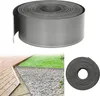 A roll of grey lawn edging is shown in the top part of the image, with a lifestyle shot of the edging installed between a wooden deck, gravel, and grass in the bottom left. A close-up of the roll is in the bottom right. Produktbild-Vorschau