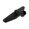 A black vacuum cleaner attachment with brown bristles lies on a white background. Produktbild-Vorschau