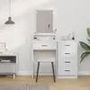 A white vanity table with drawers and a mirror, next to a gray nightstand, in a room with white walls and a wooden floor. Voir les images du produit