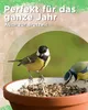 Two birds are eating seeds from a bird feeder. Produktbild-Vorschau