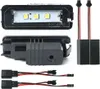 Multiple views of LED license plate lights and their wiring harnesses. Anteprima dell’immagine prodotto