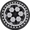 A round mosaic table top with a geometric pattern of black and white tiles. Produktbild-Vorschau