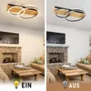 A split image showing a modern living room with a fireplace and sofas. The left side shows the room with the ceiling light on, and the right side shows the room with the ceiling light off. Produktbild-Vorschau