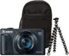 A black Canon PowerShot SX740 HS camera is shown with a black carrying case and a flexible tripod. Produktbild-Vorschau