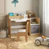 A child's desk and chair set in a room with decorative wallpaper and a toy car. Produktbild-Vorschau