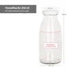 A clear product shot of a glass bottle with measurement indicators and text labels. Podgląd zdjęcia produktu