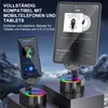 A smartphone and a tablet are displayed on stands with colorful LED lights, showcasing music playback. Produktbild-Vorschau