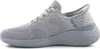 A side view of a gray Skechers slip-on sneaker against a white background. Produktbild-Vorschau