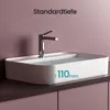 A white ceramic washbasin filled with water, with a chrome faucet. The image is set against a light purple wall and a dark purple cabinet. Voir les images du produit