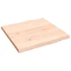 A light brown, unfinished solid oak wood tabletop with a live edge is shown from a diagonal angle against a white background. Náhled obrázku produktu