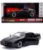 A black toy car, a replica of the Knight Rider K.I.T.T. car, is shown both in its packaging and displayed outside of it. Podgląd zdjęcia produktu