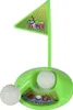 A toy golf set with a flag and two golf balls on a white background. Anteprima dell’immagine prodotto