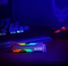 A gaming setup with a keyboard and mouse, illuminated by RGB lighting, with an SSD in the foreground. Podgląd zdjęcia produktu