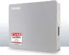 A light gray Toshiba external hard drive is shown against a white and light gray background. Produktbild-Vorschau