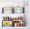 A cabinet shelf with kitchen organizers and various kitchen items. Produktbild-Vorschau