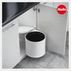 A white trash can with a black liner is installed in a corner cabinet under a kitchen counter. Náhled obrázku produktu