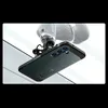 A robotic arm holding a green smartphone case. Podgląd zdjęcia produktu