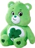 A green plush bear with a shamrock on its belly and hearts on its feet, sitting against a white background. Produktbild-Vorschau