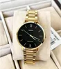 A gold Casio watch with a black face is displayed in a jewelry box. Produktbild-Vorschau