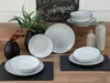 A table setting with plates, bowls, and decorative items. Produktbild-Vorschau