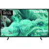 A Samsung QLED TV displaying a vibrant, abstract image with text overlays indicating features and branding. Produktbild-Vorschau