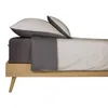 A bedding set on a bed frame. Produktbild-Vorschau