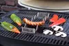 A sausage holder and food items on a grill. Produktbild-Vorschau