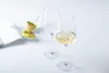 Two wine glasses and two appetizers on spoons. Produktbild-Vorschau