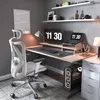 A modern home office setup with an ergonomic chair, desk, computer, and accessories. Produktbild-Vorschau
