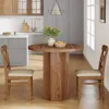 A round dining table with two chairs in a kitchen setting. Produktbild-Vorschau