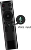 A black remote control with a voice input icon and text overlay. Voir les images du produit