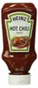 Flasche Heinz Hot Chili Sauce in roter Quetschflasche mit weißem Deckel, auf dem Etikett eine scharfe Fleischspeise und rote Chilischoten. Náhled obrázku produktu