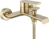 A close-up studio shot of a gold-colored bathtub faucet with a shower hose attached. Produktbild-Vorschau