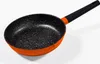 A frying pan with an orange exterior and a speckled black interior, set against a white background. Produktbild-Vorschau