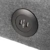 A close-up view of a gray fabric surface with a black circular insert containing two USB ports and a USB symbol. Voir les images du produit