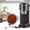 A bottomless portafilter filled with coffee grounds is shown in the foreground, with an espresso machine in the background. Coffee beans are scattered on the surface. Podgląd zdjęcia produktu