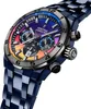 A close-up, angled view of a men's chronograph watch with a colorful dial and a blue metal band, set against a white background. Voir les images du produit