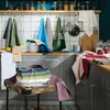 A kitchen scene with various kitchen textiles displayed. Produktbild-Vorschau