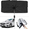 Schwarzer Windschutzscheiben-Sonnenschutzschirm für Autos, geöffnet, in einem silbernen Auto installiert und in einer Hand gefaltet Náhled obrázku produktu