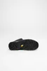 The bottom view of a black hiking boot is shown against a white background. Voir les images du produit