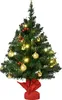 A small, decorated Christmas tree with lights and ornaments on a white background. Podgląd zdjęcia produktu