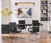 A modern conference room with a table and chairs, along with a bookcase and artwork. Produktbild-Vorschau